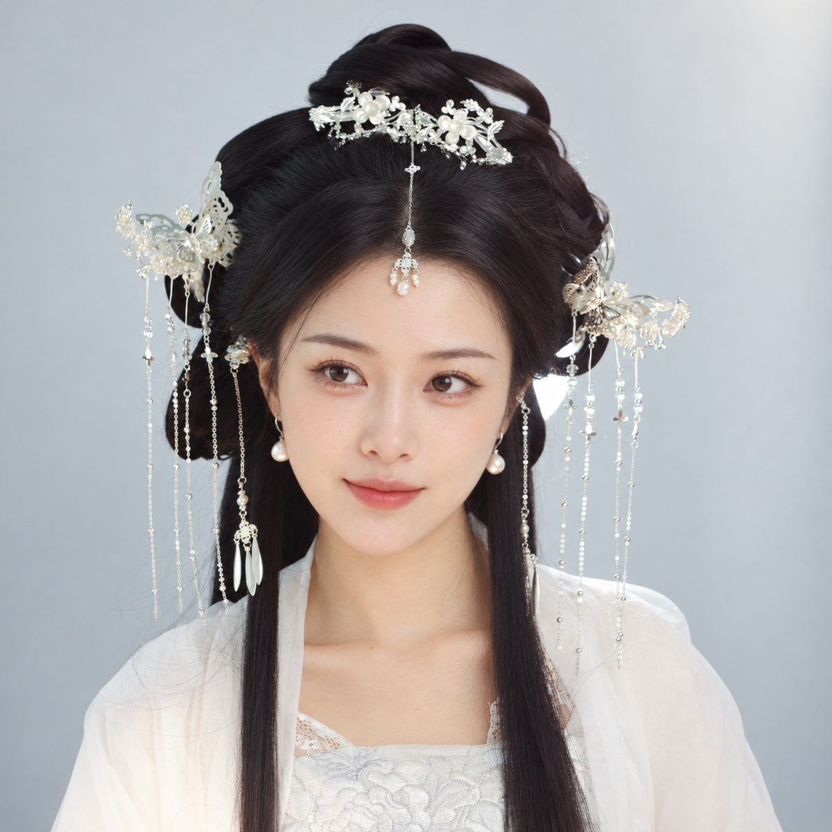 Silver-tone floral and butterfly hair accessories with beaded tassels, model styling view 02