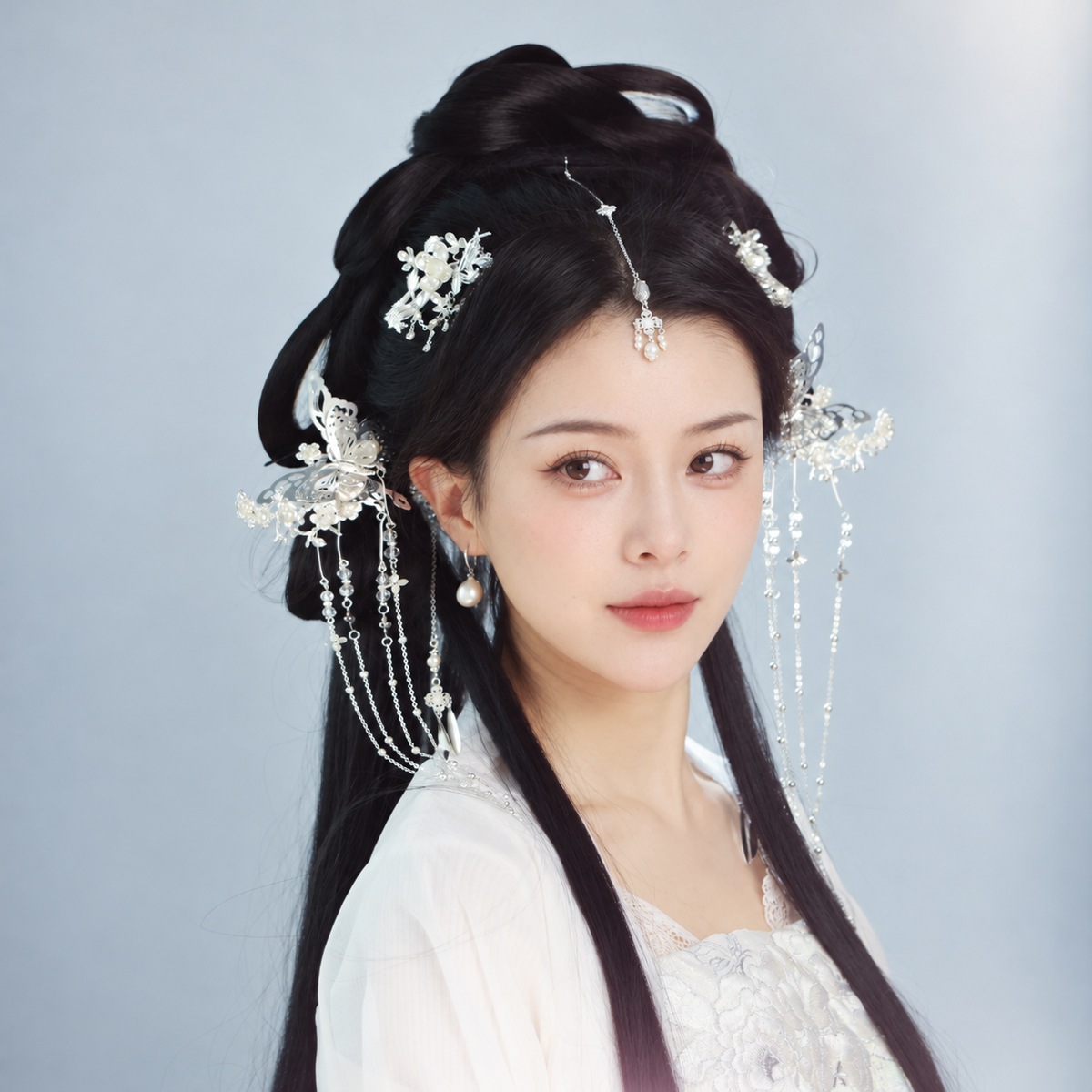 Silver-tone floral and butterfly hair accessories with beaded tassels, model styling view 04