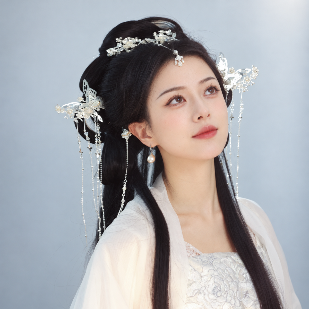 Silver-tone floral and butterfly hair accessories with beaded tassels, model styling view 06