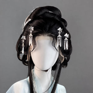 Four silver-tone butterfly temple ornaments with hanging beads
