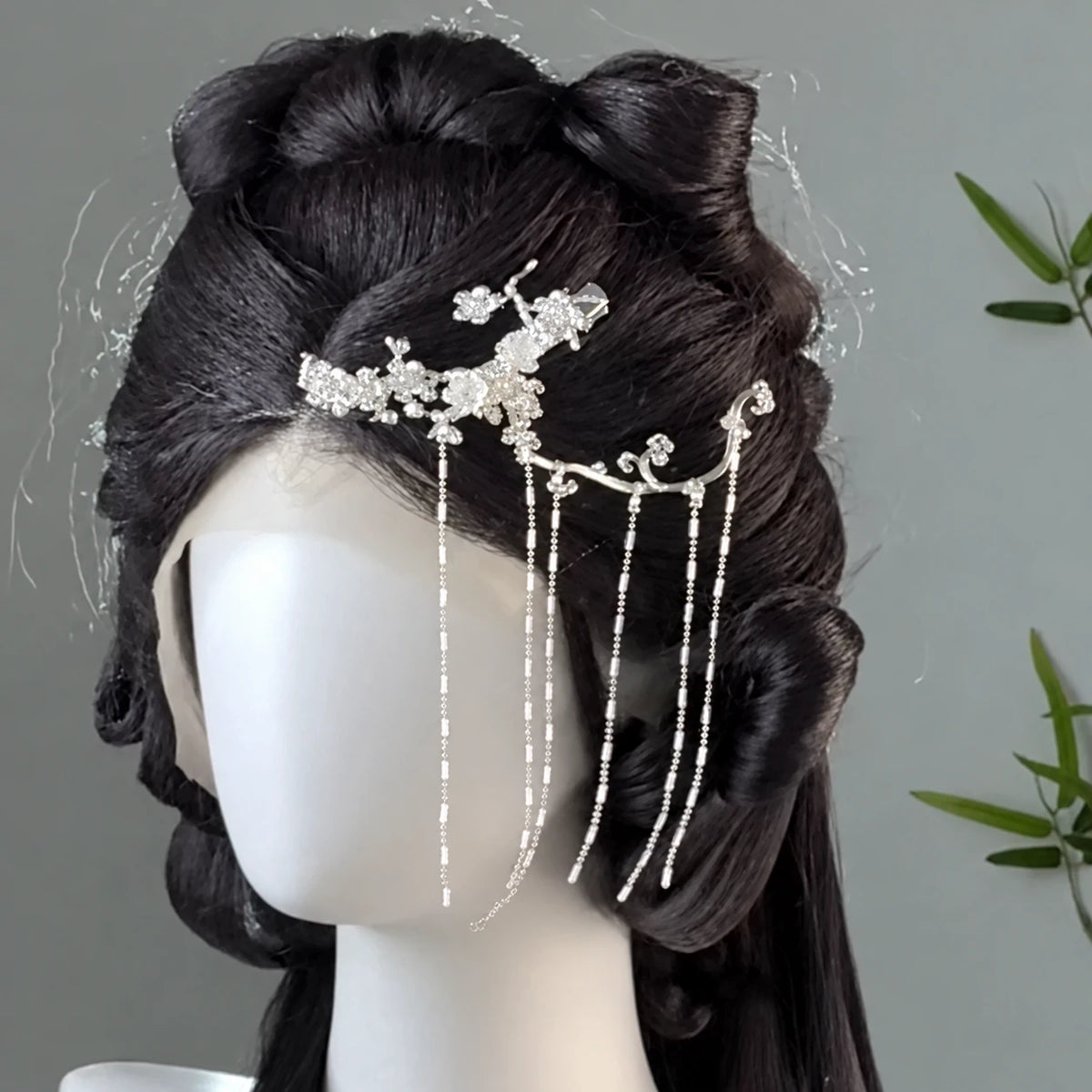 Silver-tone pine branch ornament styled in an updo