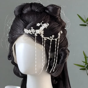 Silver-tone pine branch ornament styled in an updo
