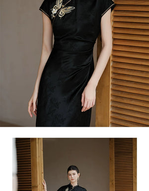 Detailed product image of the Smoke-Ink black acetate embroidered long qipao dress, showing fabric texture, finish and craftsmanship.