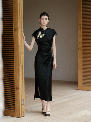 Three-quarter product view of the Smoke-Ink black acetate embroidered long qipao dress, a refined black qipao dress for elegant occasions.