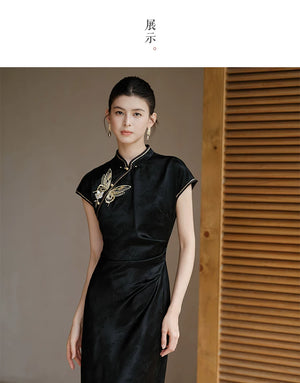 Smoke-Ink black acetate embroidered long qipao dress styled to show its fit and drape, including acetate sheen, refined embroidery and long modern cheongsam silhouette.
