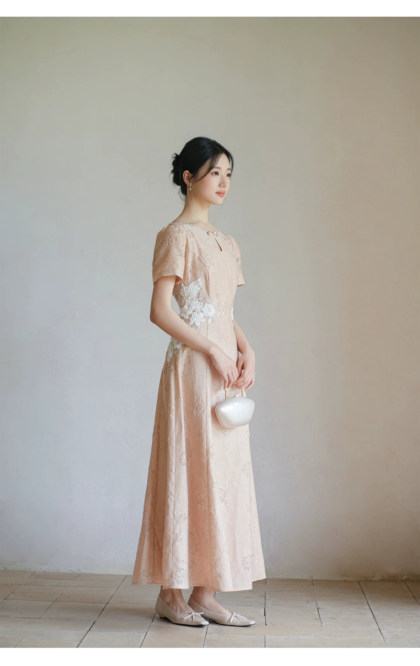 Silhouette and fit view of the Soft Sand Pink floral applique cheongsam dress, a contemporary modern pink qipao dress.