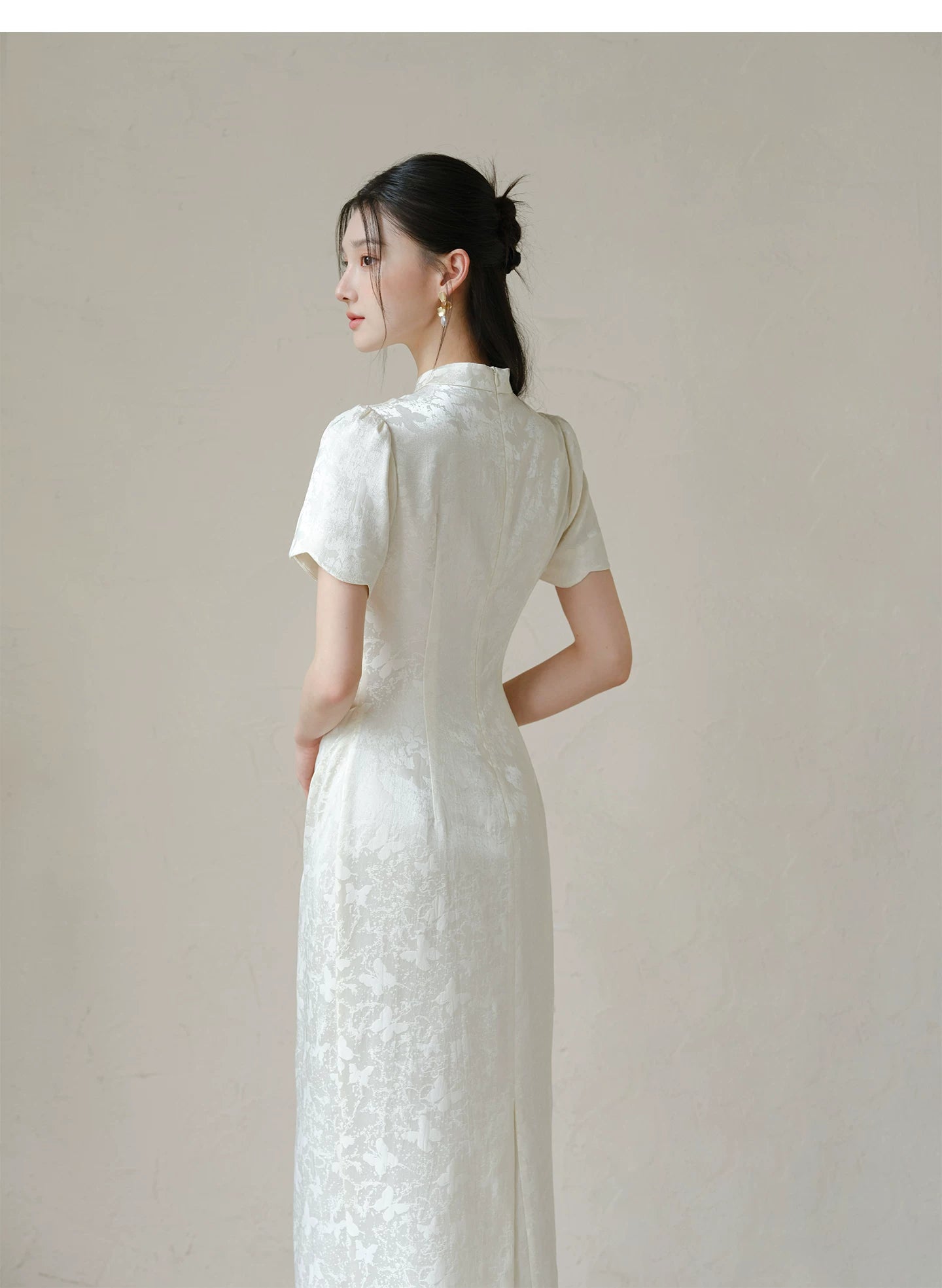 Silhouette and fit view of the Soft White jacquard pleated qipao dress, a contemporary modern white qipao dress.