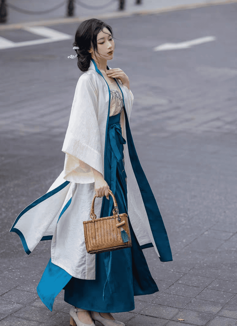 Featuring a diverse collection of Hanfu styles, this display presents a blend of traditional and modern elements, from the intricate embroidery of classic Hanfu to contemporary menswear. The assortment includes authentic Tang Dynasty dresses and detailed Ming Dynasty Hanfu, alongside luxurious royal attire and scholar officials' outfits. With a special emphasis on men's Hanfu, the exhibit highlights the rich cultural tapestry of traditional Asian clothing and modern, Asian-inspired fashion