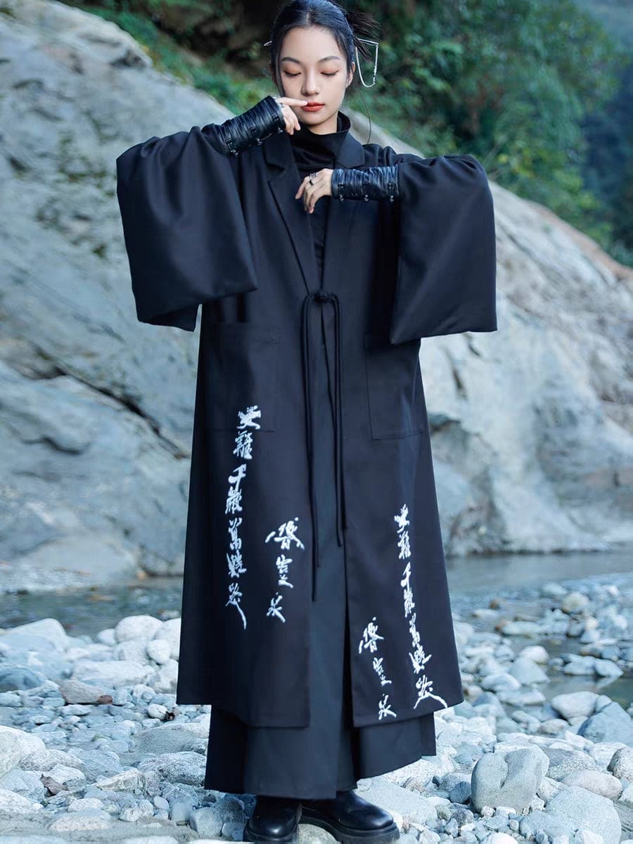 Modern Chinese clothes featuring a black hanfu coat for men, a blend of traditional hanfu menswear and Tang dynasty clothing with a modernized hanfu style, suitable for casual wear or winter hanfu style. The male model is also wearing Chinese cloak and hanfu with pants, depicting a Chinese warrior outfit. The photo indicates where to buy hanfu, including hanfu Amazon and oriental clothing stores near you