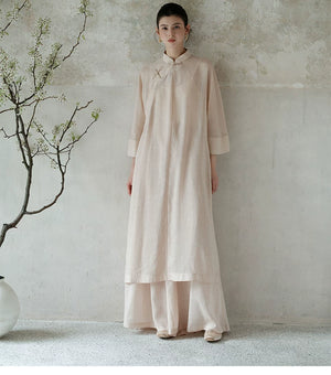 Tea Beige ramie long top and wide-leg pants set styled to show its fit and drape, including breathable ramie layers, relaxed long top and fluid wide-leg trousers.