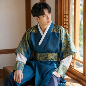 Teal blue gold men's Korean hanbok robe set seated window lifestyle photo