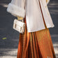 Orange modern hanfu dress for women, inspired by traditional Song Dynasty style and crafted from luxurious silk. This versatile hanfu includes a coordinating coat or jacket, making it ideal for winter wear, Chinese New Year celebrations, or casual outings. Suitable for events such as graduations and cosplay, this hanfu blends classic Chinese elegance with contemporary fashion, perfect for anyone looking for where to buy hanfu or shop authentic hanfu for sale. Available at our online hanfu shop, offering opt