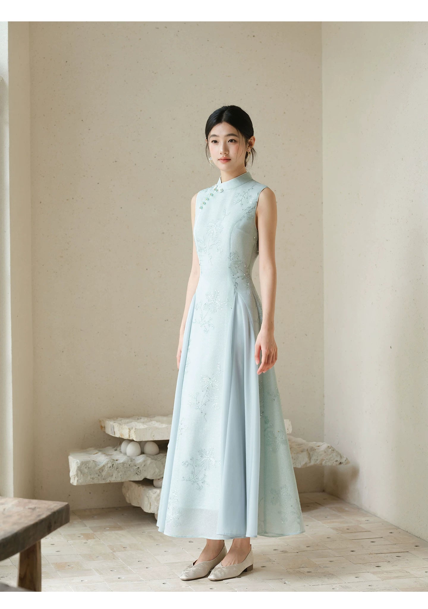 Design view of the Water-Blue jacquard A-line qipao dress, highlighting jacquard texture, Chinese collar and graceful A-line cheongsam silhouette.