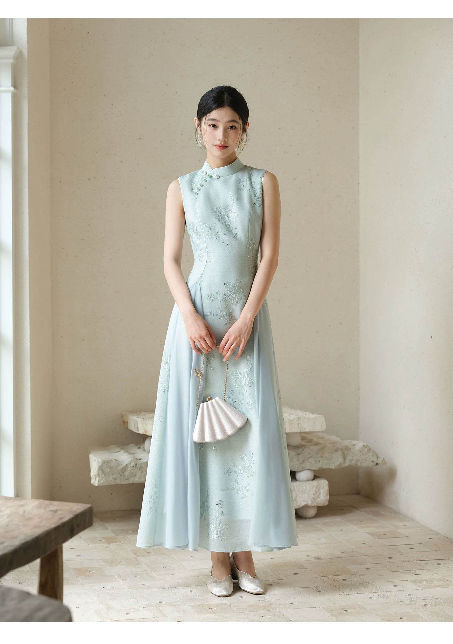 Detailed product image of the Water-Blue jacquard A-line qipao dress, showing fabric texture, finish and craftsmanship.