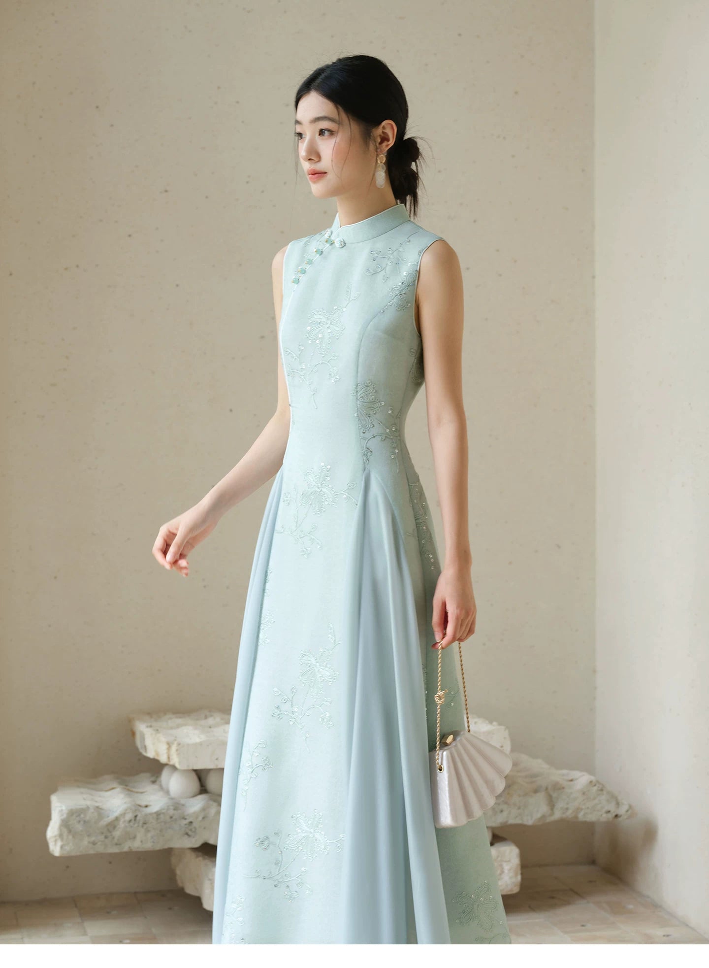 Occasion styling image of the Water-Blue jacquard A-line qipao dress, presented as an elegant modern blue qipao dress.