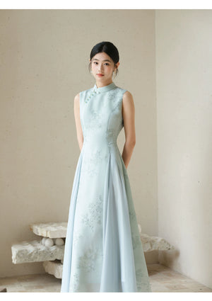 Additional styling view of the Water-Blue jacquard A-line qipao dress, showing the garment's shape, texture and finish.