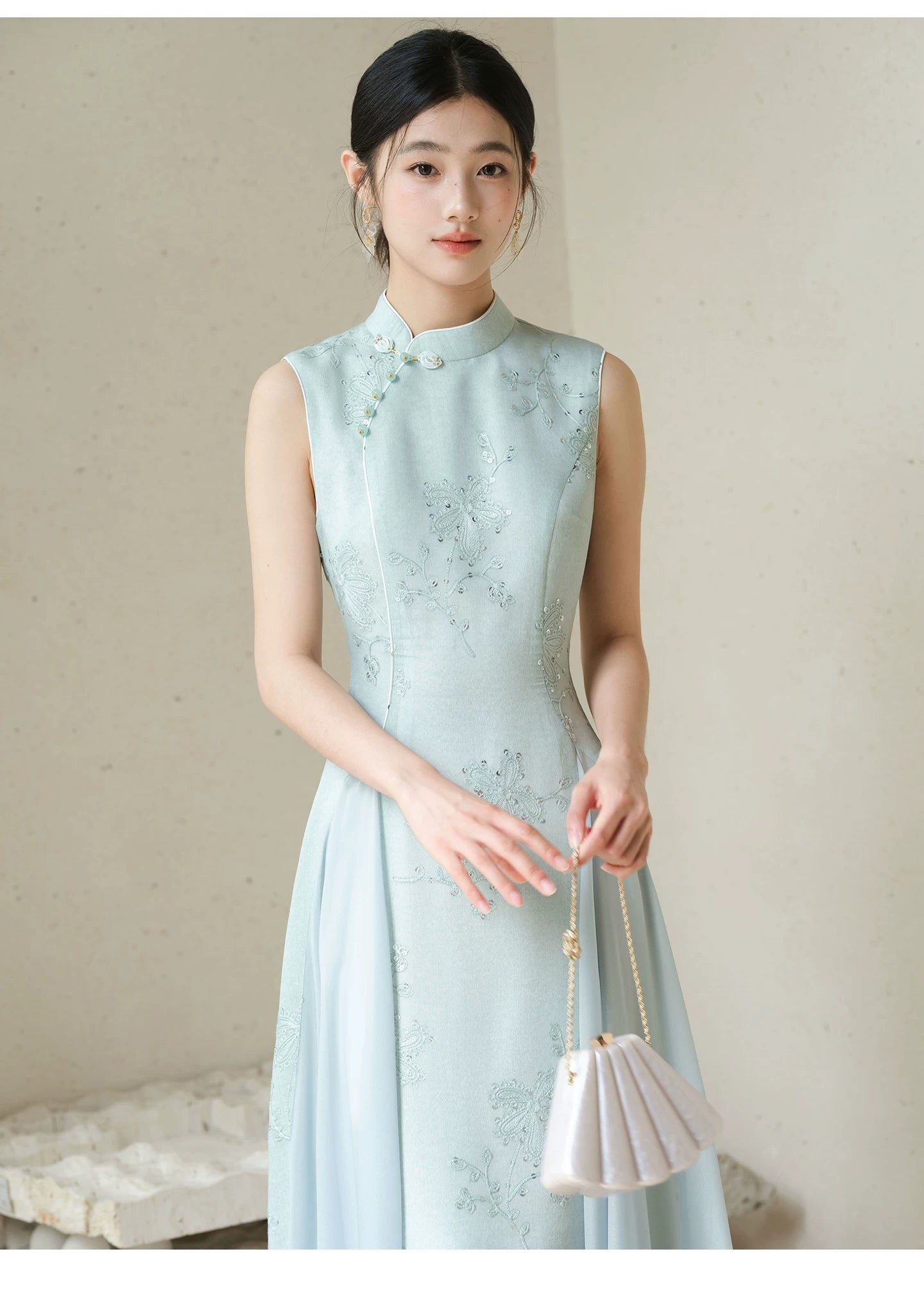 Front styling view of the Water-Blue jacquard A-line qipao dress, with jacquard texture, Chinese collar and graceful A-line cheongsam silhouette.