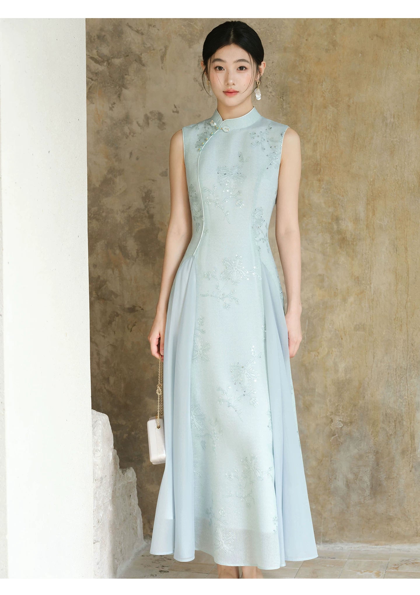 Detailed product image of the Water-Blue jacquard A-line qipao dress, showing fabric texture, finish and craftsmanship.
