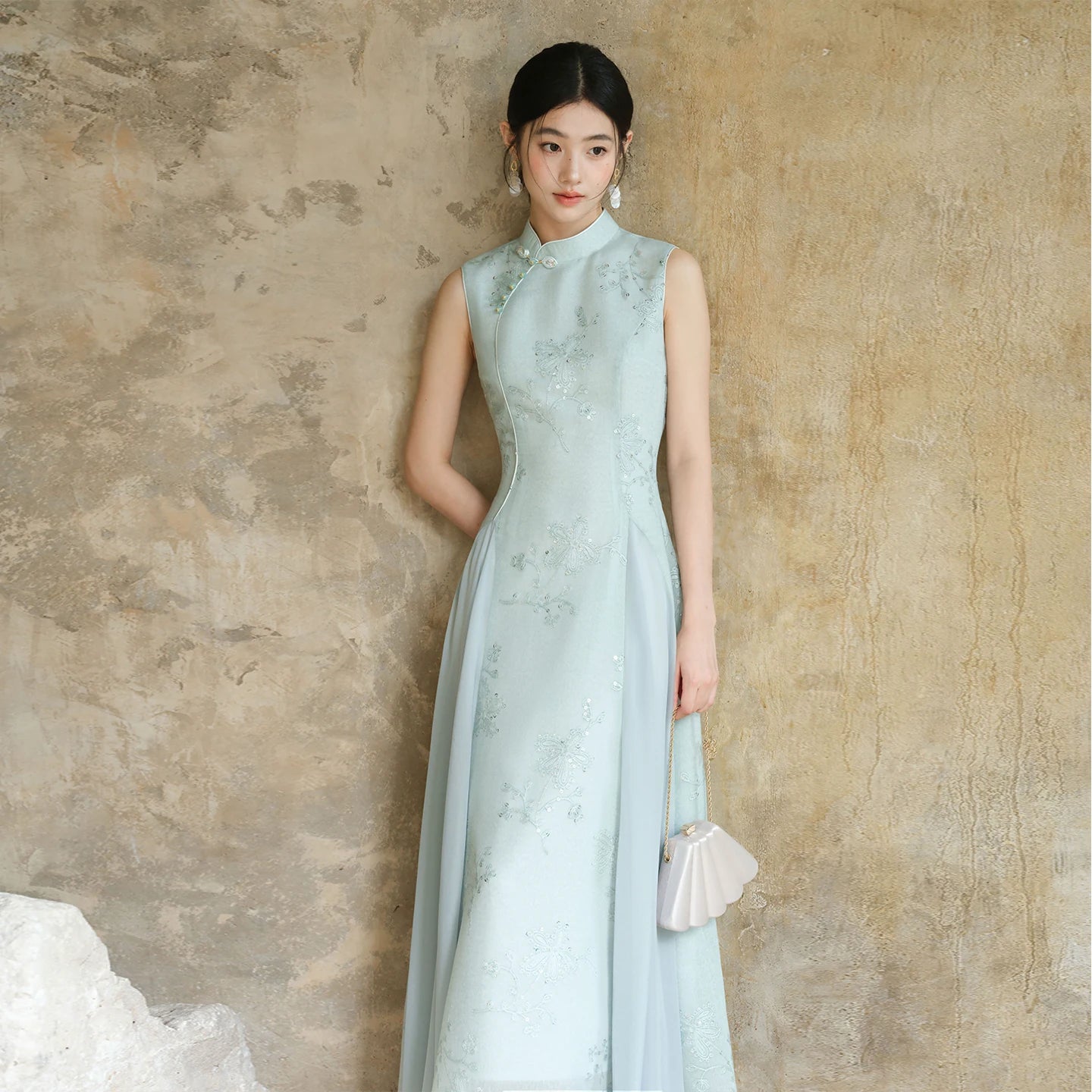 Water-Blue jacquard A-line qipao dress shown as a polished modern blue qipao dress, highlighting jacquard texture, Chinese collar and graceful A-line cheongsam silhouette.