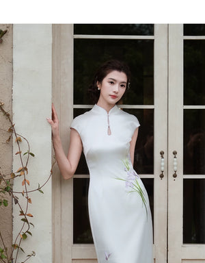 White cap-sleeve cheongsam with a keyhole collar, front view