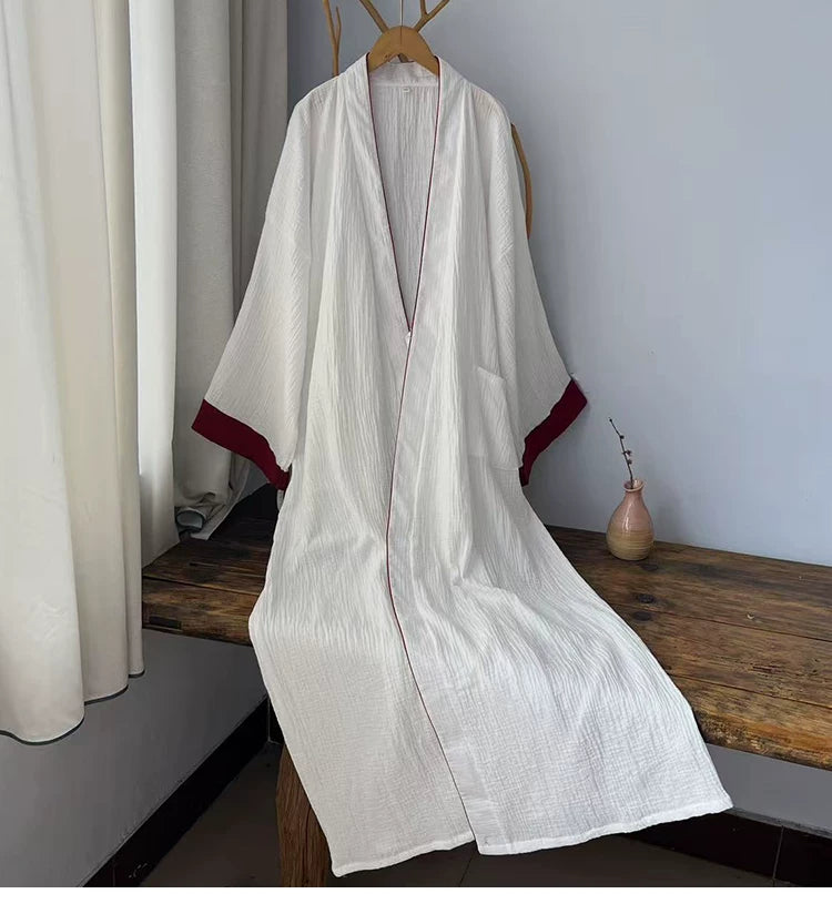 Deep red crossover collar trim detail on the white cotton gauze robe
