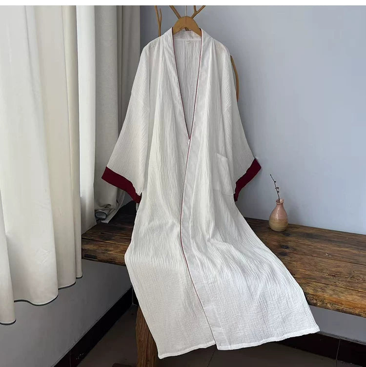 White two-layer cotton gauze robe hanging with red collar and cuff accents