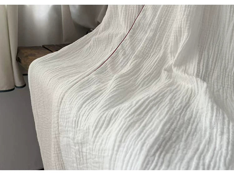 Flowing white cotton gauze hem and lightweight two-layer fabric detail