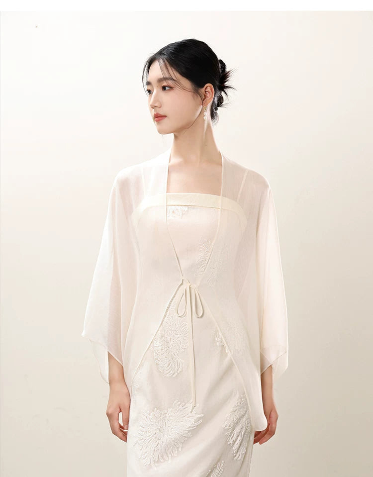 Close product view of the White embroidered slip dress and sheer outer layer, focused on its Chinese-inspired design details.