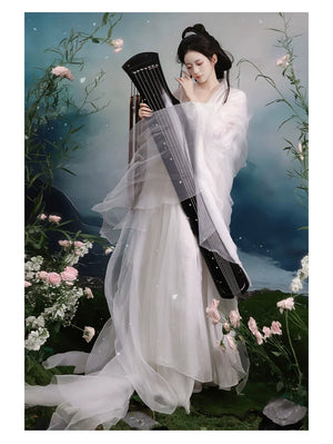 White layered Hanfu worn with a musical prop
