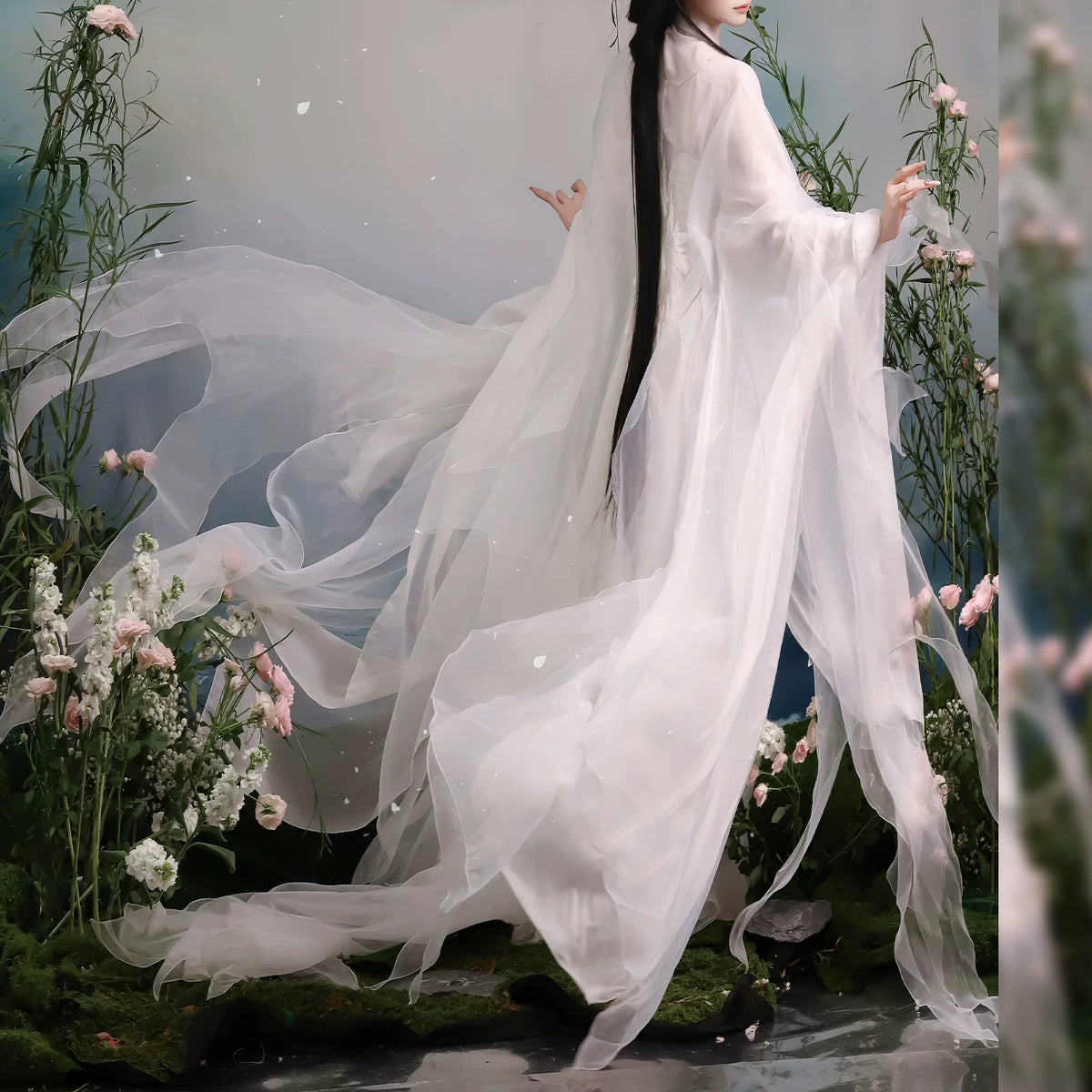 White sheer robe fabric flowing behind the wearer