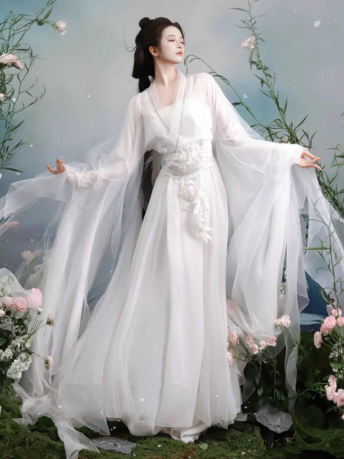 White waist-high dress styling with a decorative sash