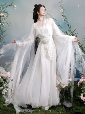 White waist-high dress styling with a decorative sash