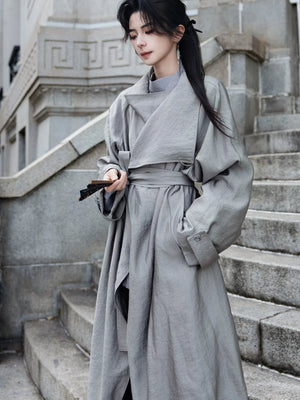 Gray belted coat on stone steps