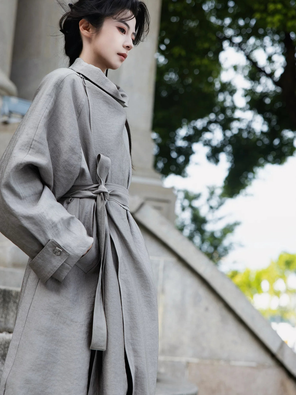 Wrap collar and tied belt detail