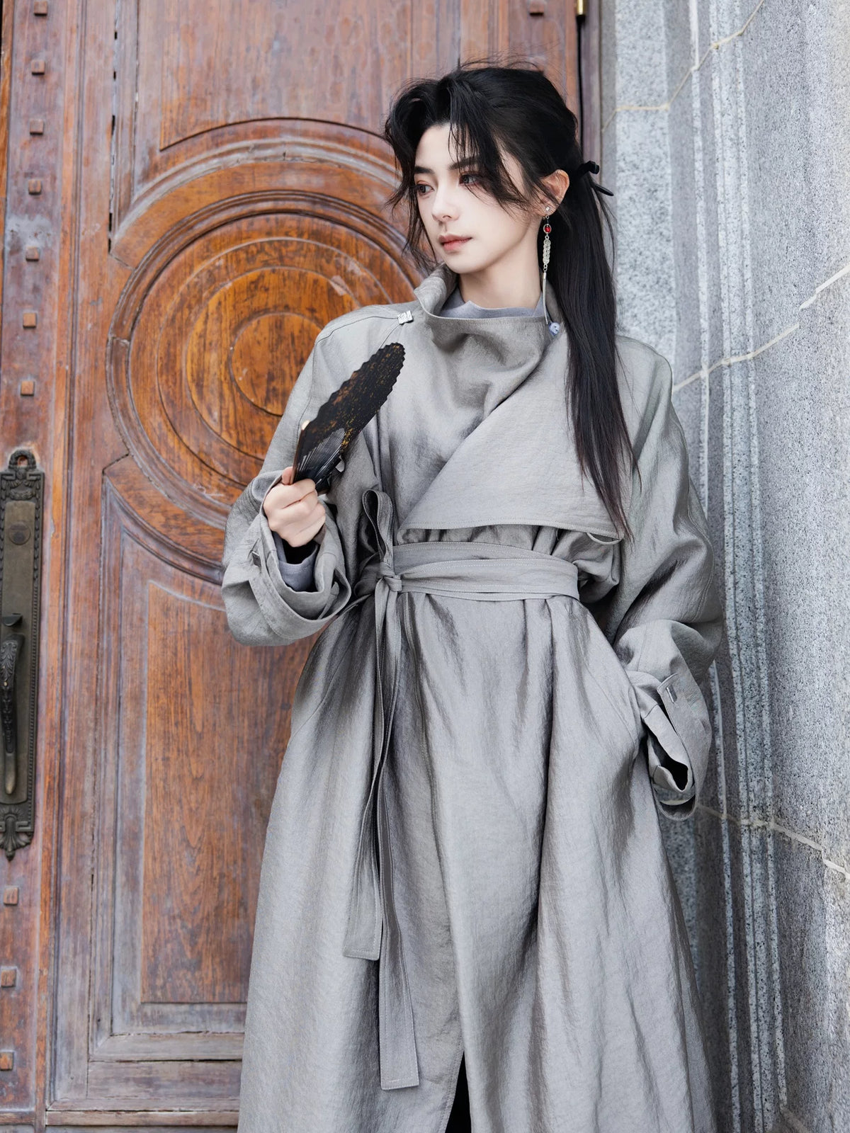 Gray long coat worn with black trousers