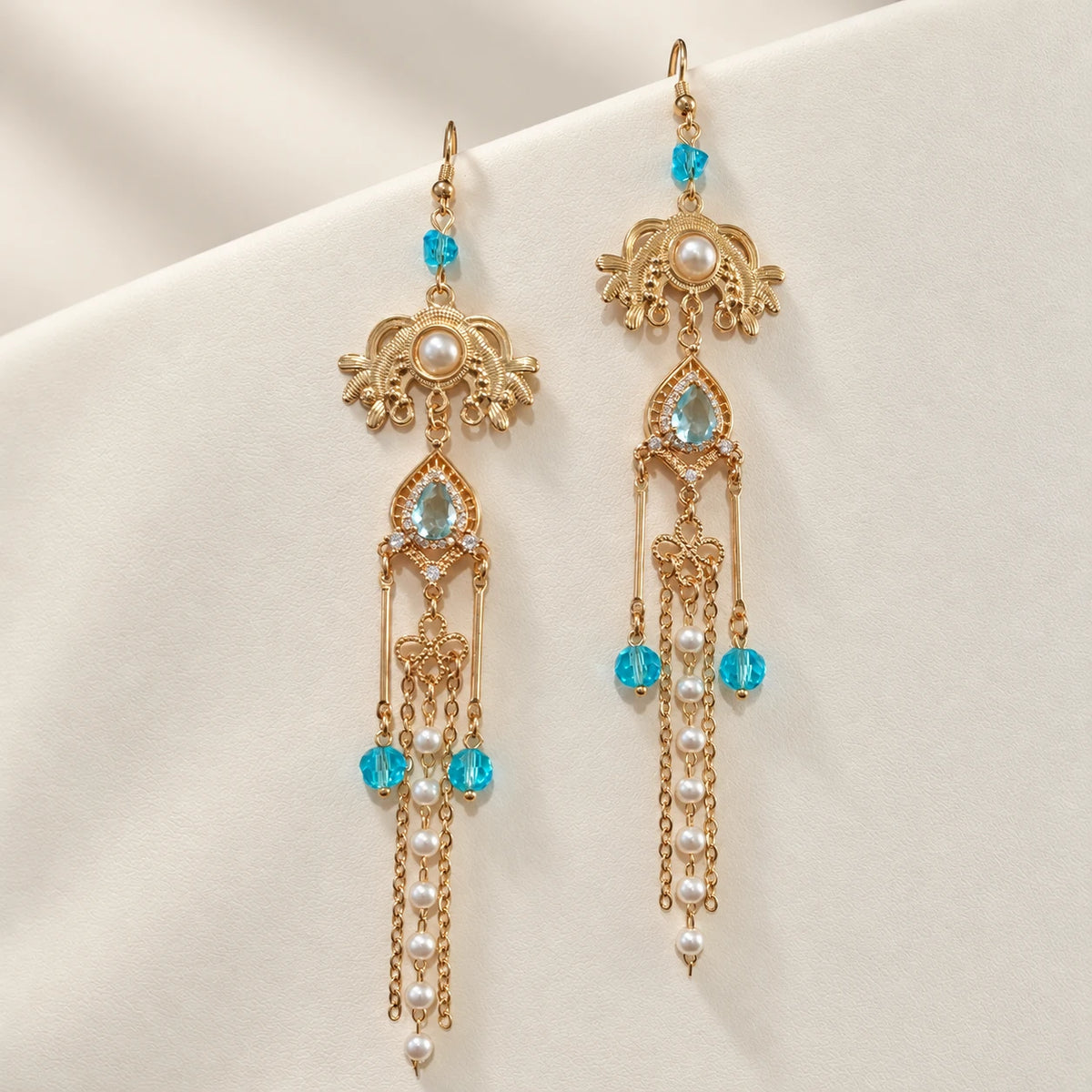 Long matching earrings with blue accents