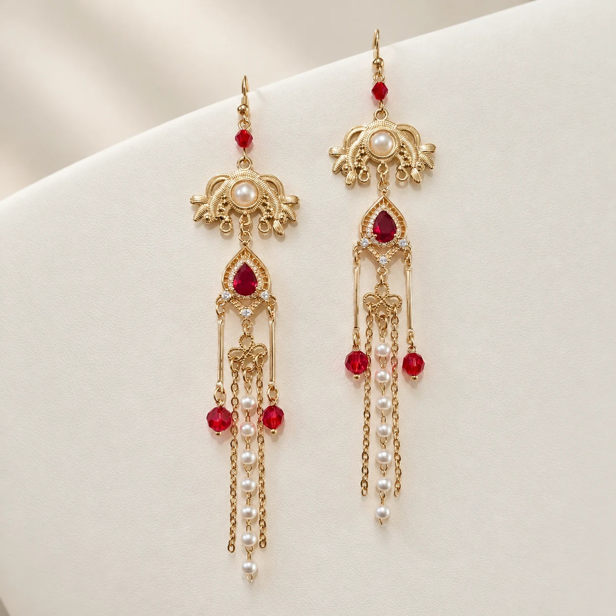 Long matching earrings with red accents