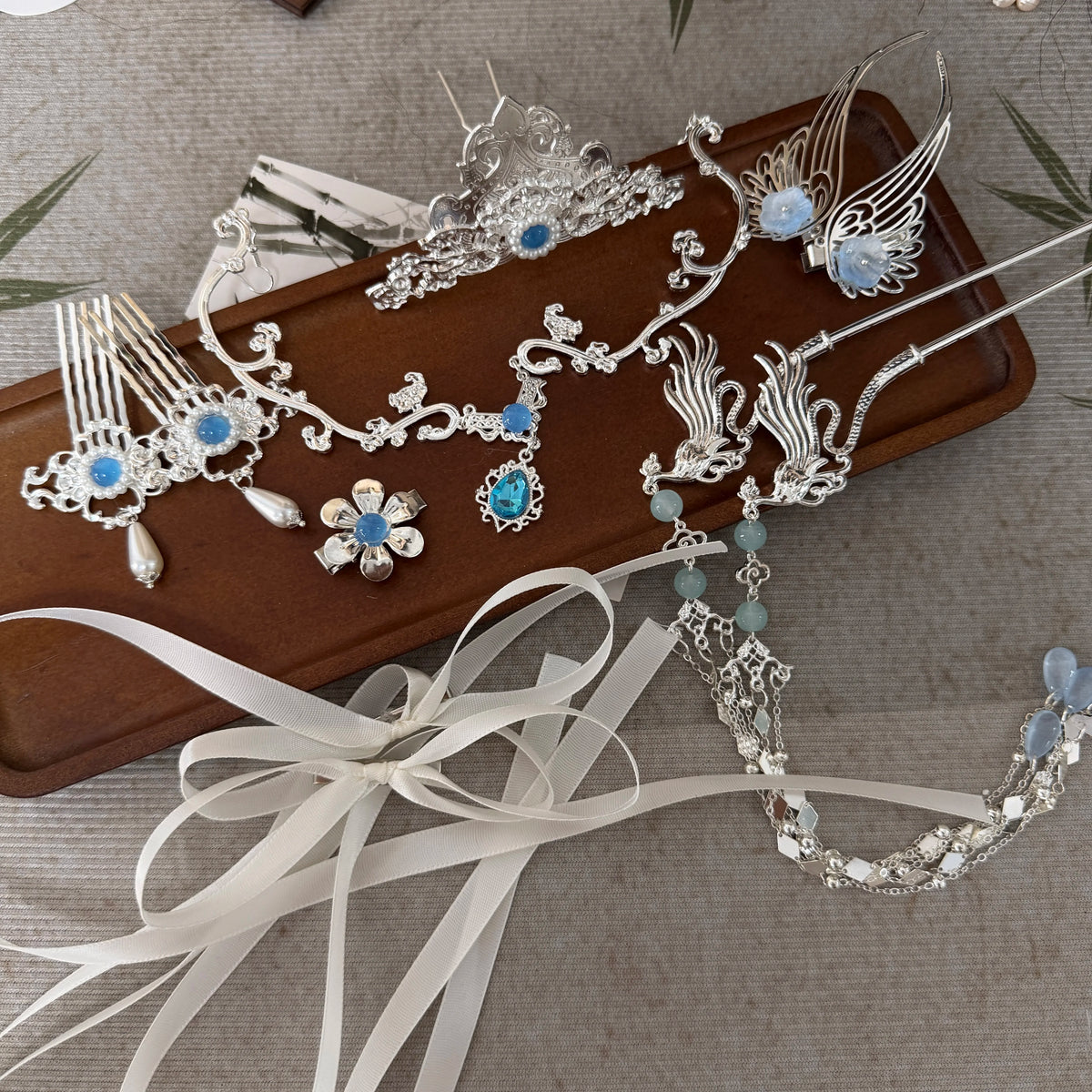 Close view of blue accents and fine metalwork on Yueling hair accessories