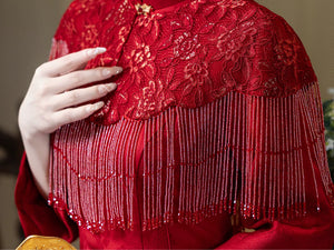 Floral lace capelet and long red beaded fringe detail