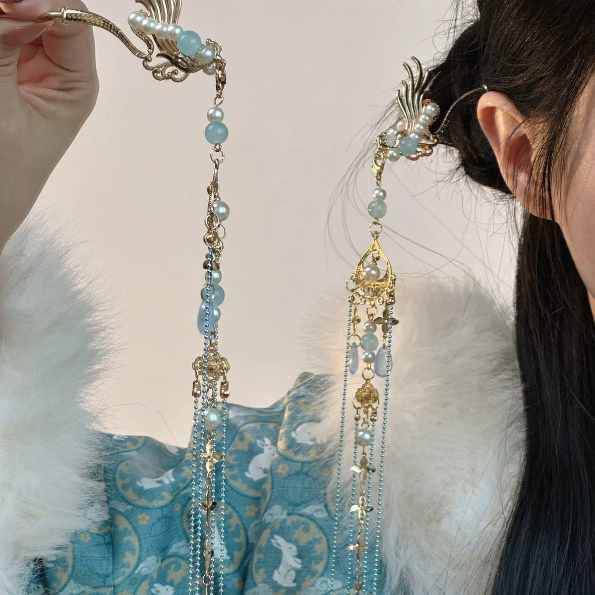 Blue beaded hairpin pair showing gold-tone details and long tassels