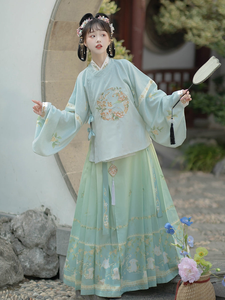 An imperial Chinese scholar official robed in elaborately decorated royal Ming dynasty Hanfu with rich embroidered patterns and angular motifs, wearing a traditional mandarin hat topped with a large red tassel, representing traditional East Asian court clothing during the height of imperial China