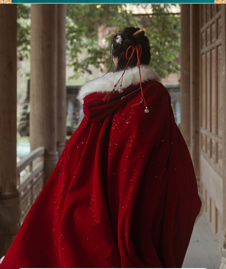 Red Hanfu Cape Featuring a diverse collection of Hanfu styles, this display presents a blend of traditional and modern elements, from the intricate embroidery of classic Hanfu to contemporary menswear. The assortment includes authentic Tang Dynasty dresses and detailed Ming Dynasty Hanfu, alongside luxurious royal attire and scholar officials' outfits. With a special emphasis on men's Hanfu, the exhibit highlights the rich cultural tapestry of traditional Asian clothing and modern, Asian-inspired fashion