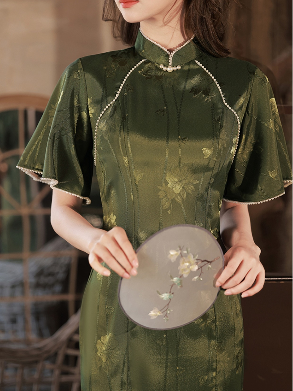 Featuring an elegant display of an array of items including a Green Qipao dress, a modern Qipao shirt and a sexy Cheongsam, this collection presents a blend of traditional and modern styles. The modern Cheongsam dress, along with the Cheongsam modern top, redefines traditional aesthetics with a contemporary twist. Adding an element of allure is the sexy Cheongsam lingerie, complemented by a green Cheongsam shirt in comfortable fabric.