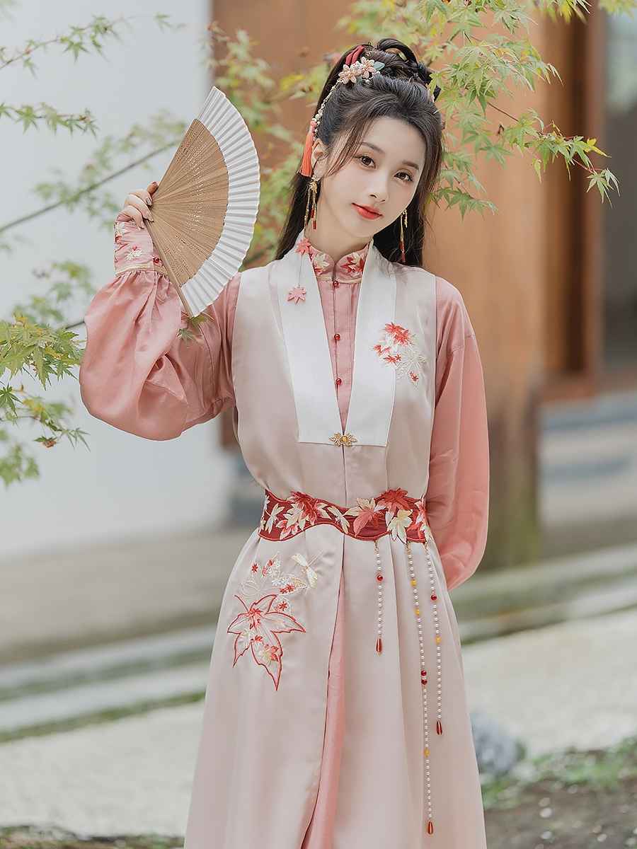 Pink modern Hanfu dress featuring a stylish and elegant design with intricate embroidery and traditional Chinese accents. Perfect for special events or cultural celebrations. Exudes sophistication and femininity in a contemporary take on traditional Hanfu attire.