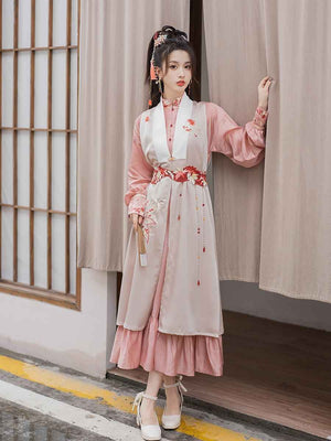 Pink modern Hanfu dress featuring a stylish and elegant design with intricate embroidery and traditional Chinese accents. Perfect for special events or cultural celebrations. Exudes sophistication and femininity in a contemporary take on traditional Hanfu attire.