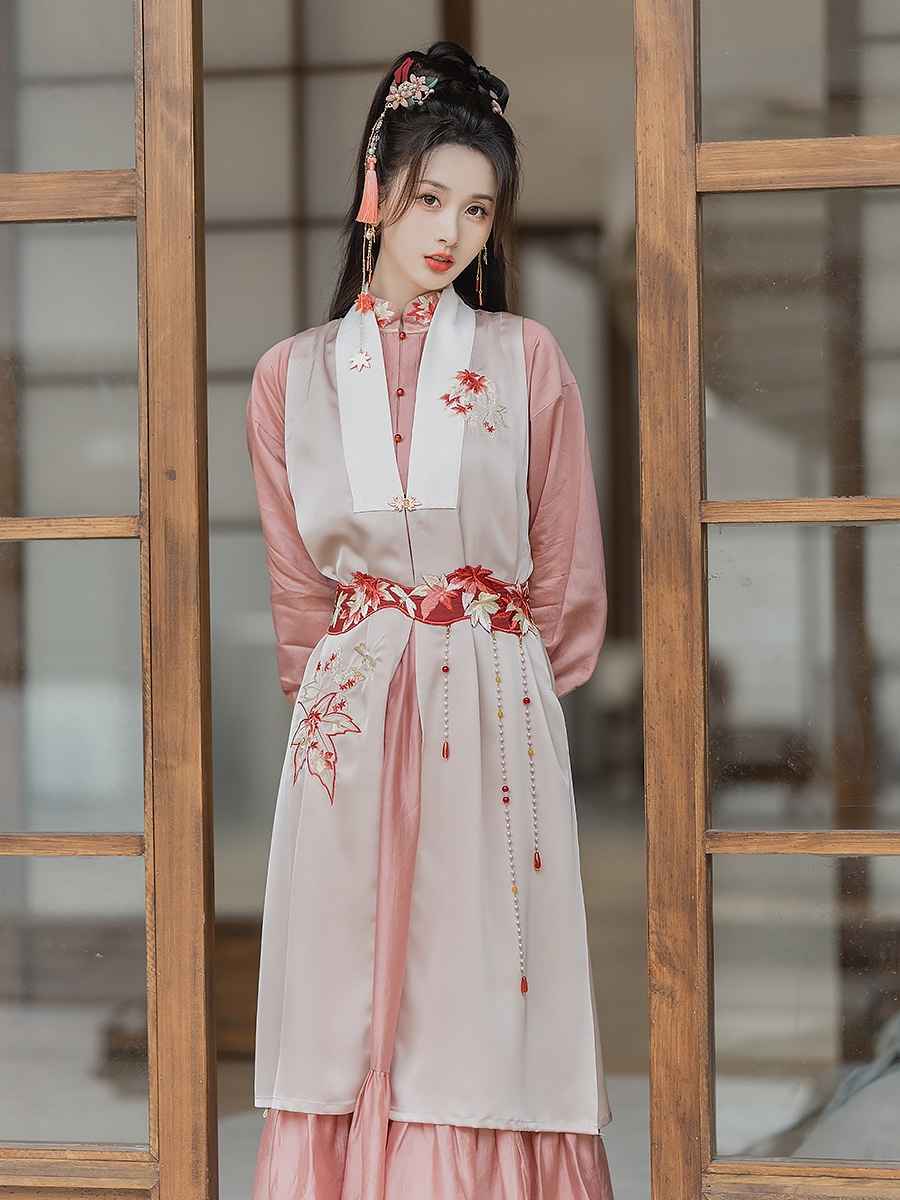 Pink modern Hanfu dress featuring a stylish and elegant design with intricate embroidery and traditional Chinese accents. Perfect for special events or cultural celebrations. Exudes sophistication and femininity in a contemporary take on traditional Hanfu attire.