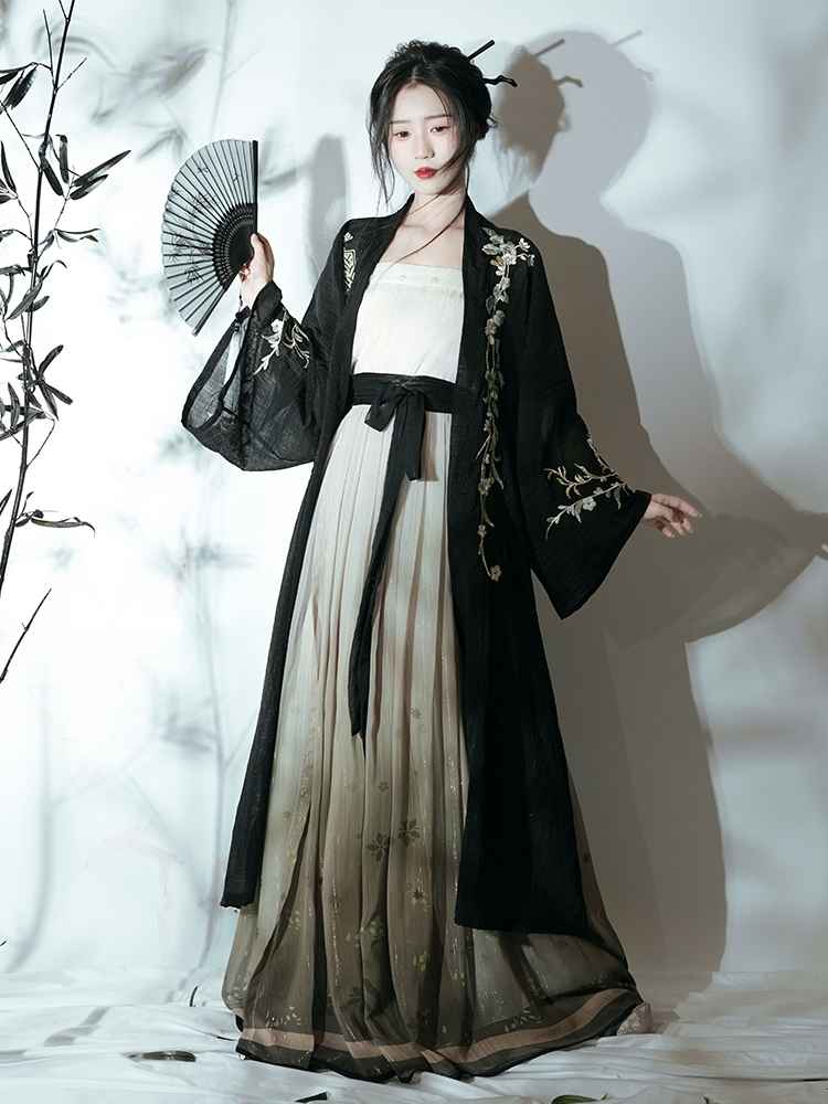 Song Dynasty Featuring a diverse collection of Hanfu styles, this display presents a blend of traditional and modern elements, from the intricate embroidery of classic Hanfu to contemporary menswear. The assortment includes authentic Tang Dynasty dresses and detailed Ming Dynasty Hanfu, alongside luxurious royal attire and scholar officials' outfits. With a special emphasis on men's Hanfu, the exhibit highlights the rich cultural tapestry of traditional Asian clothing and modern, Asian-inspired fashion