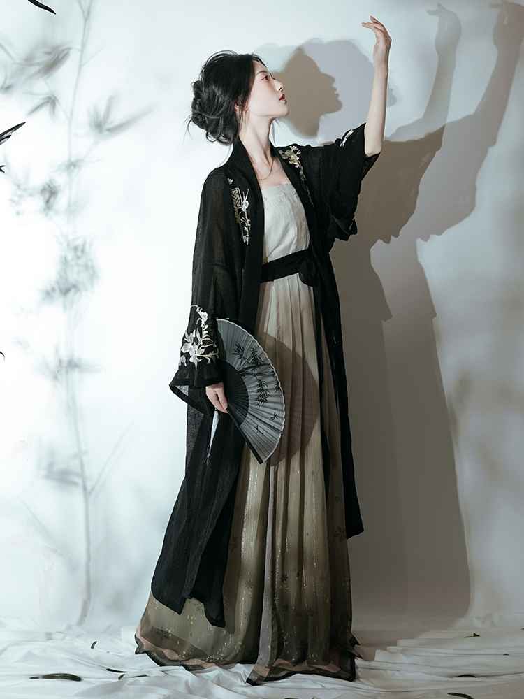 Song Dynasty Featuring a diverse collection of Hanfu styles, this display presents a blend of traditional and modern elements, from the intricate embroidery of classic Hanfu to contemporary menswear. The assortment includes authentic Tang Dynasty dresses and detailed Ming Dynasty Hanfu, alongside luxurious royal attire and scholar officials' outfits. With a special emphasis on men's Hanfu, the exhibit highlights the rich cultural tapestry of traditional Asian clothing and modern, Asian-inspired fashion