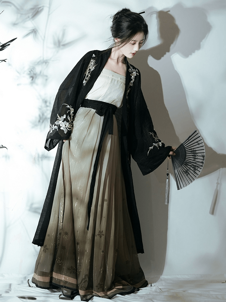 Featuring a diverse collection of Hanfu styles, this display presents a blend of traditional and modern elements, from the intricate embroidery of classic Hanfu to contemporary menswear. The assortment includes authentic Tang Dynasty dresses and detailed Ming Dynasty Hanfu, alongside luxurious royal attire and scholar officials' outfits. With a special emphasis on men's Hanfu, the exhibit highlights the rich cultural tapestry of traditional Asian clothing and modern, Asian-inspired fashion
