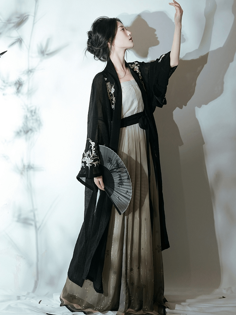 Featuring a diverse collection of Hanfu styles, this display presents a blend of traditional and modern elements, from the intricate embroidery of classic Hanfu to contemporary menswear. The assortment includes authentic Tang Dynasty dresses and detailed Ming Dynasty Hanfu, alongside luxurious royal attire and scholar officials' outfits. With a special emphasis on black Hanfu, the exhibit highlights the rich cultural tapestry of traditional Asian clothing and modern, Asian-inspired fashion
